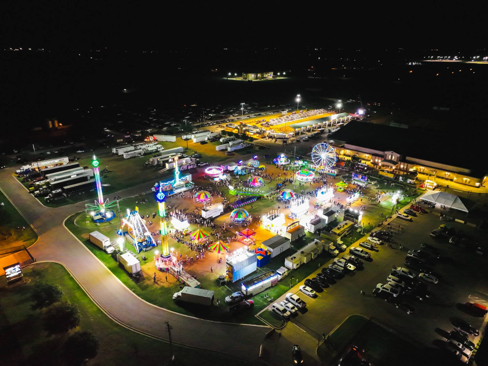 Aerial photo of a carnival lit up at night